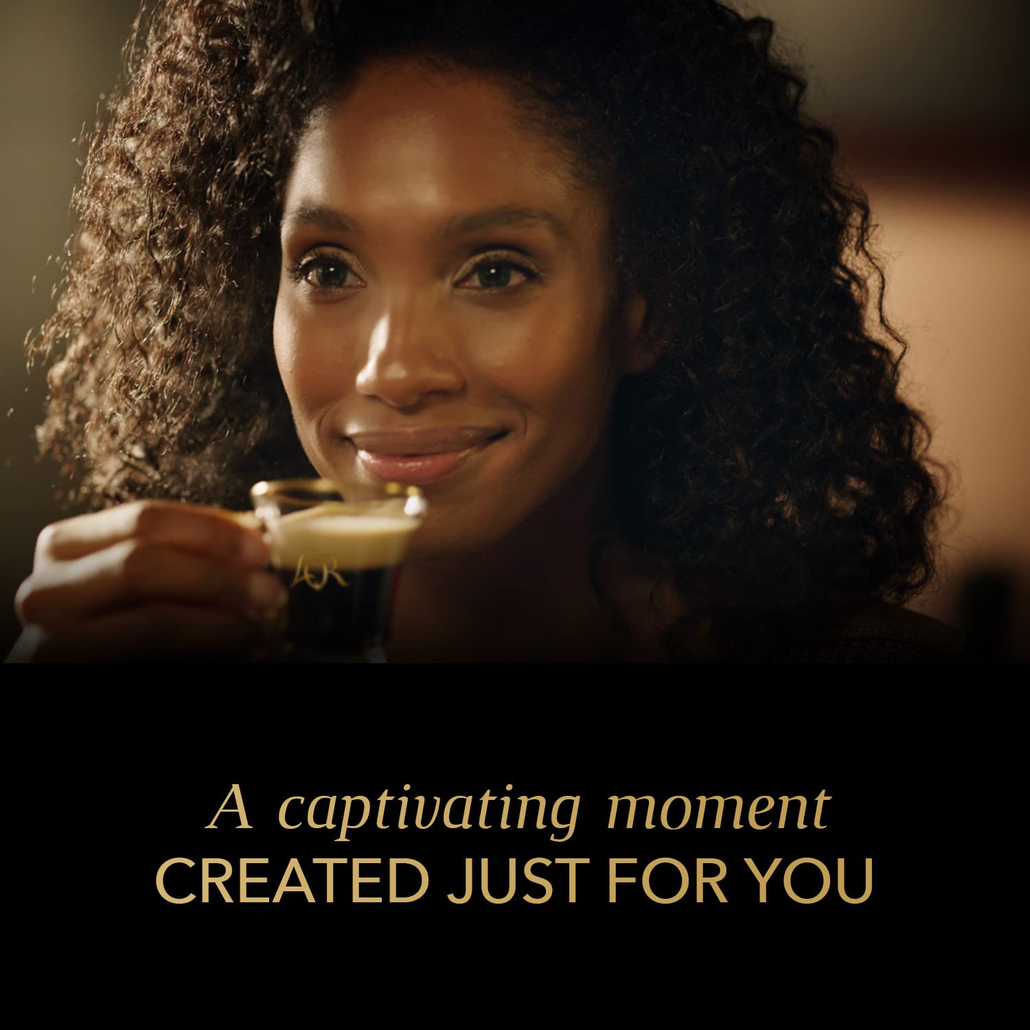 L'OR lifestyle scene with espresso cup and capsules showing daily ritual benefit