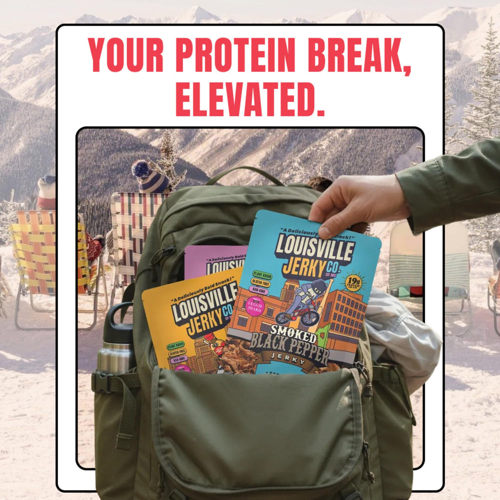 Person hiking with Louisville Vegan Jerky pack for on-the-go protein snack