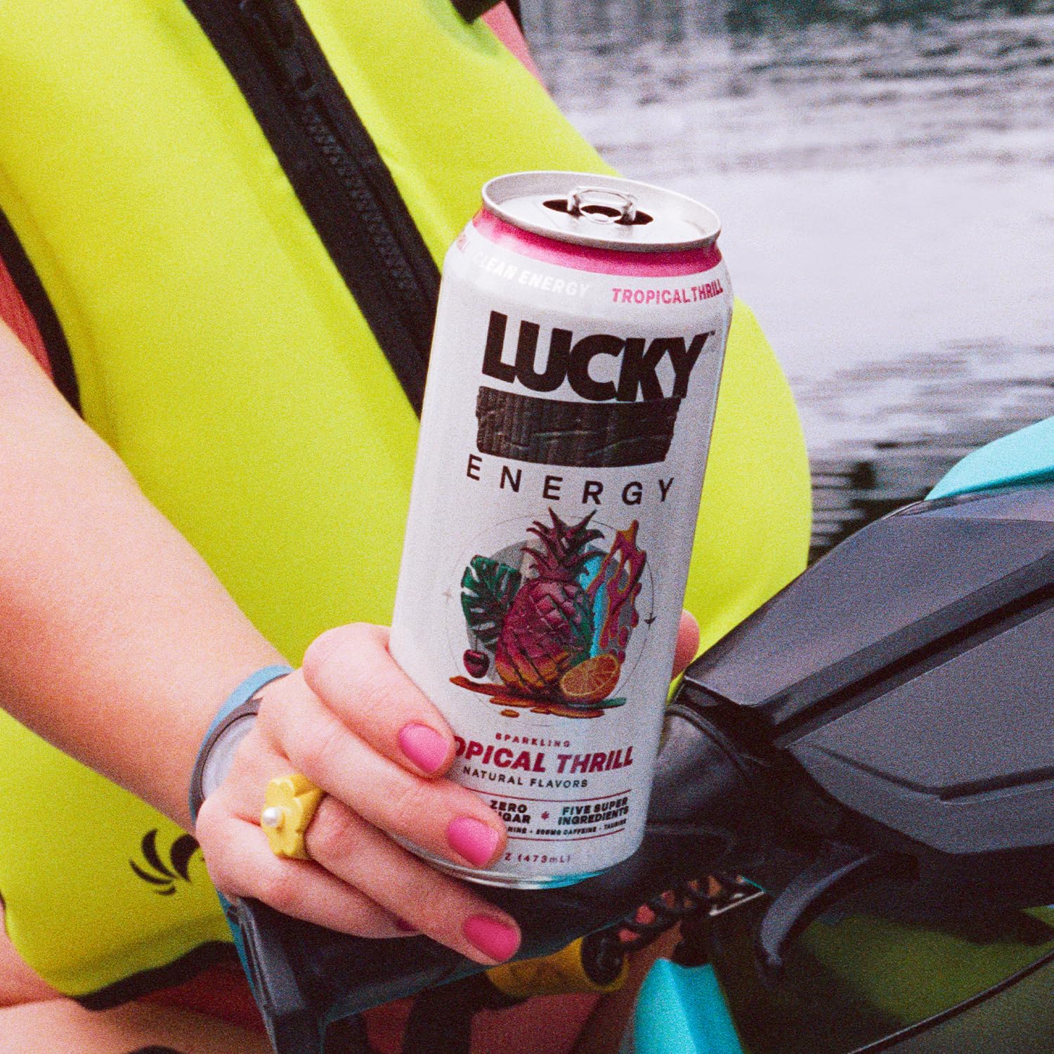 Lucky Energy can in runner's hand after workout showing fast recovery and sustained focus
