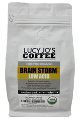 Lucy Jo's Coffee front packaging shot showing the organic Brainstorm 11 oz bag and brand benefit