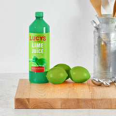 Lucy’s lime juice poured into a glass illustrating fresh cocktail use