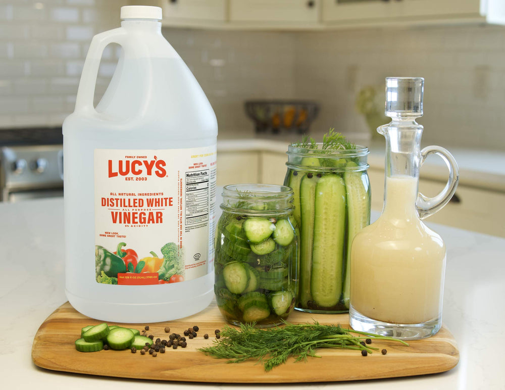 One-gallon Lucy’s bottle beside common kitchen items to show scale and savings