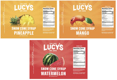 Lucy’s syrup being poured over shaved ice to create colorful, refreshing snow cones
