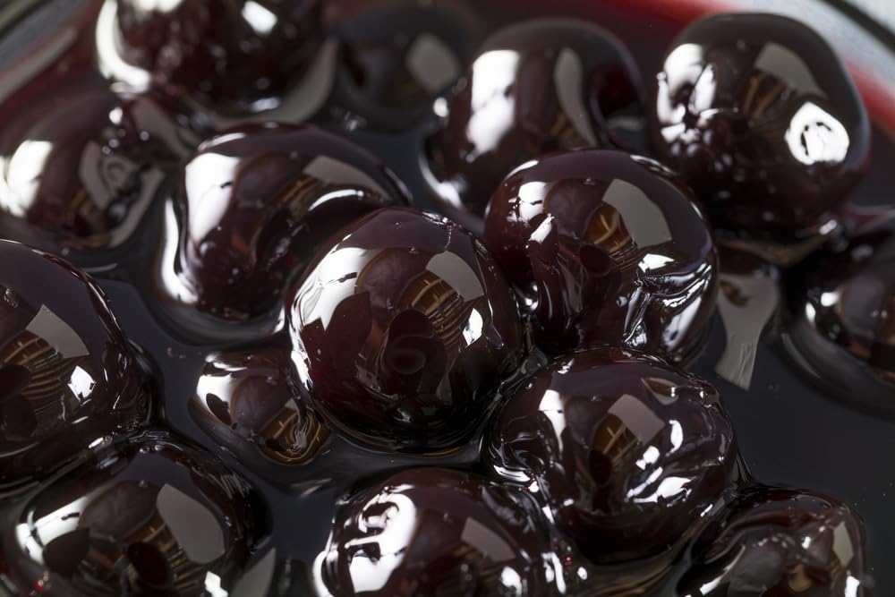 Luxardo cherries placed on dessert illustrating sweet finishing touch