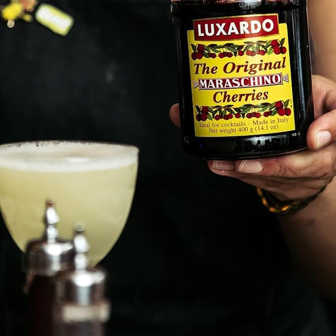 luxardo syrup pour detail showing thick cherry syrup enhancing cocktails and desserts benefit