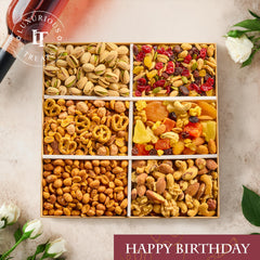 Luxurious Treats open box overhead showing six sealed snack sections and variety