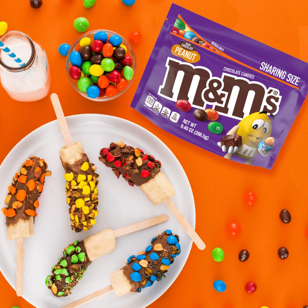 Hand holding M&M's bag showing size and portion convenience