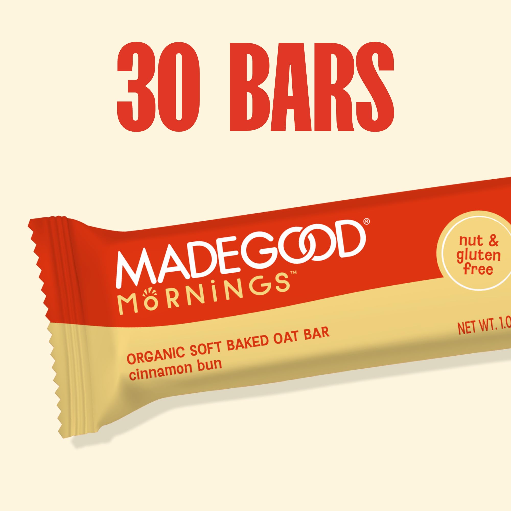 Hand holding a MadeGood bar to show the 1.06 oz size and easy portioning