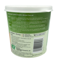 Mae Ploy green curry paste close-up texture highlighting aromatic herbs and vivid color