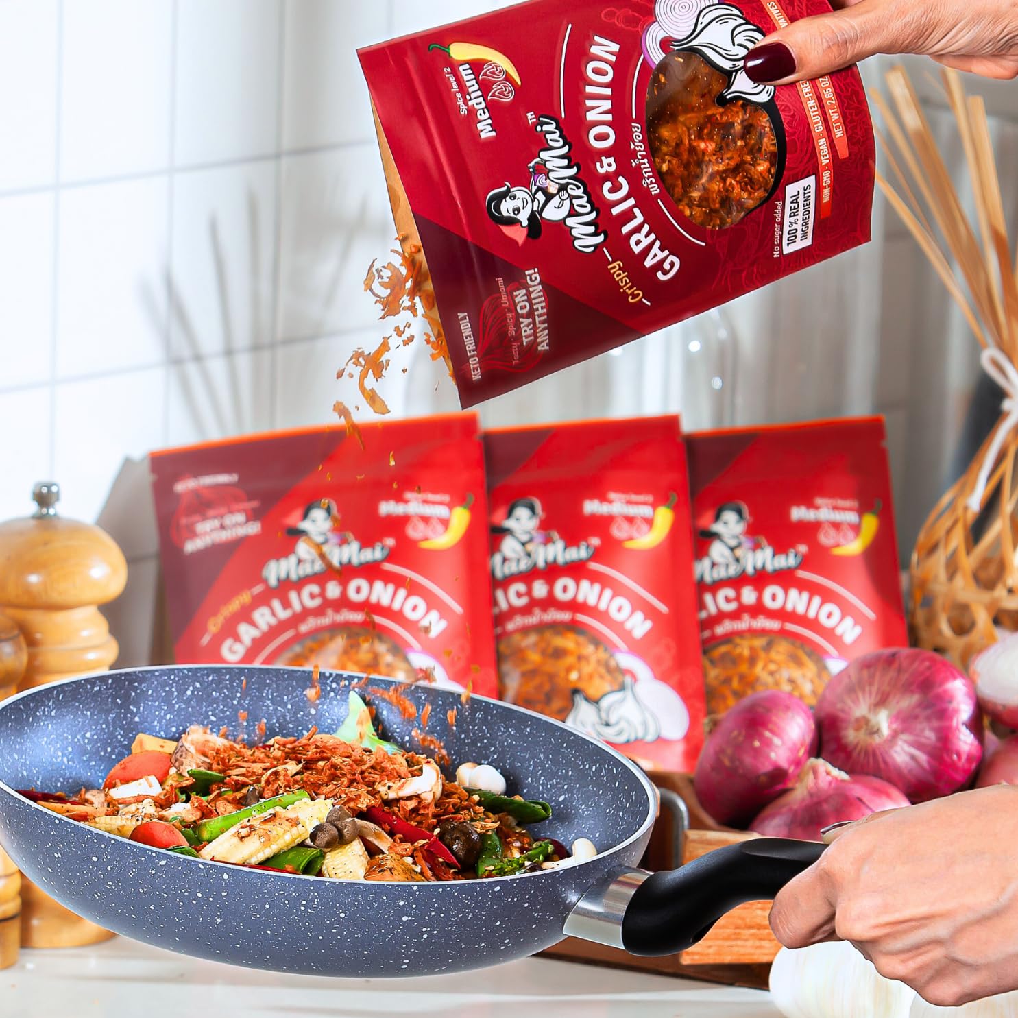 MaeMai bag open pouring onto rice to show dry-fried non-greasy topping benefit