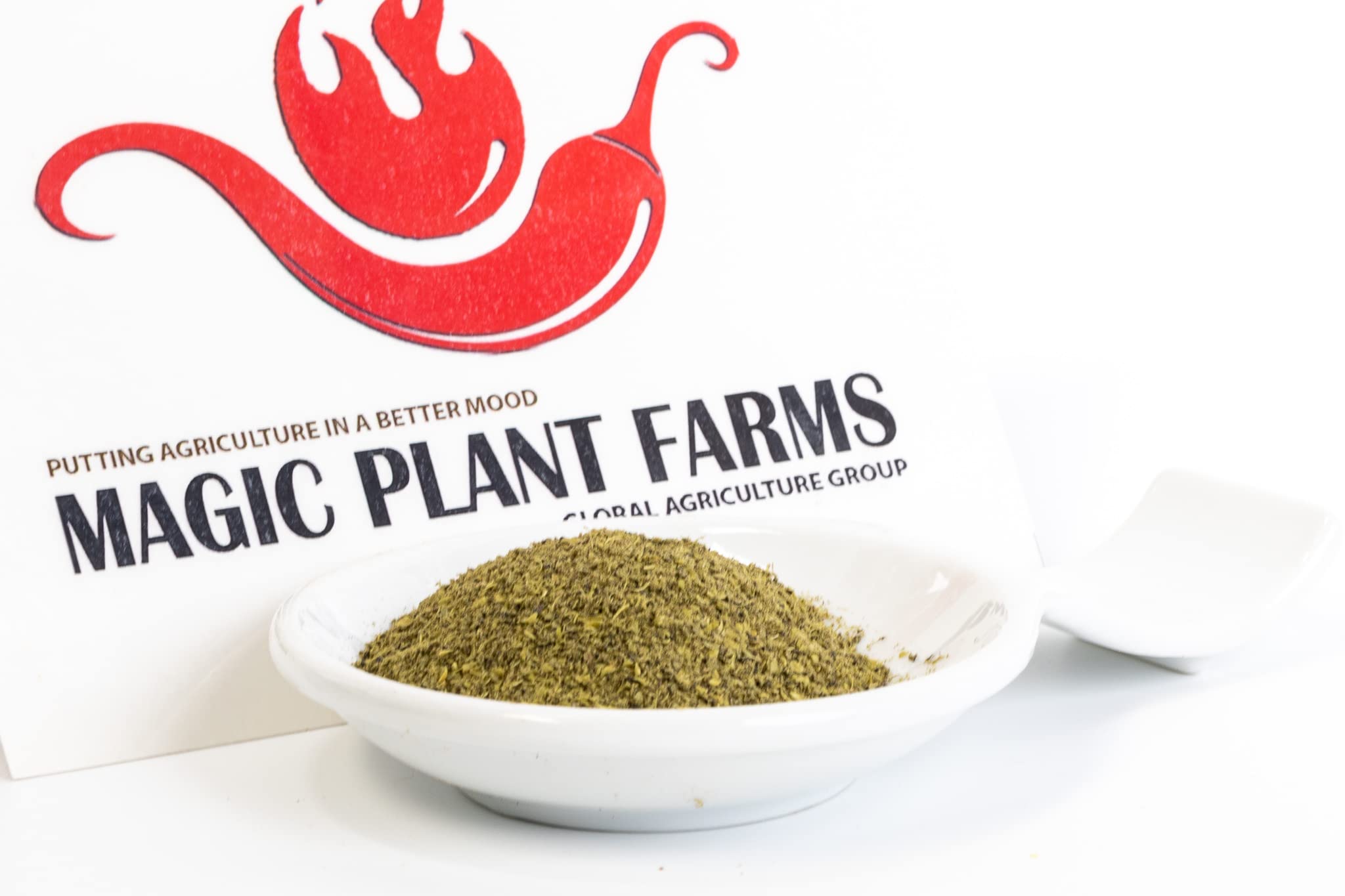 Magic Plant sprinkled on grilled fish in a kitchen setting, showcasing brightening and finishing benefit