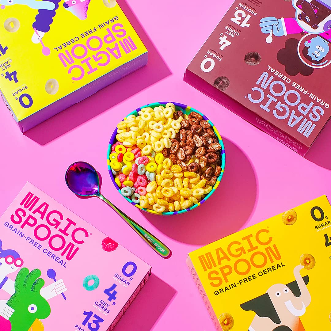 Spoonful of Magic Spoon cereal beside a hand indicating serving size