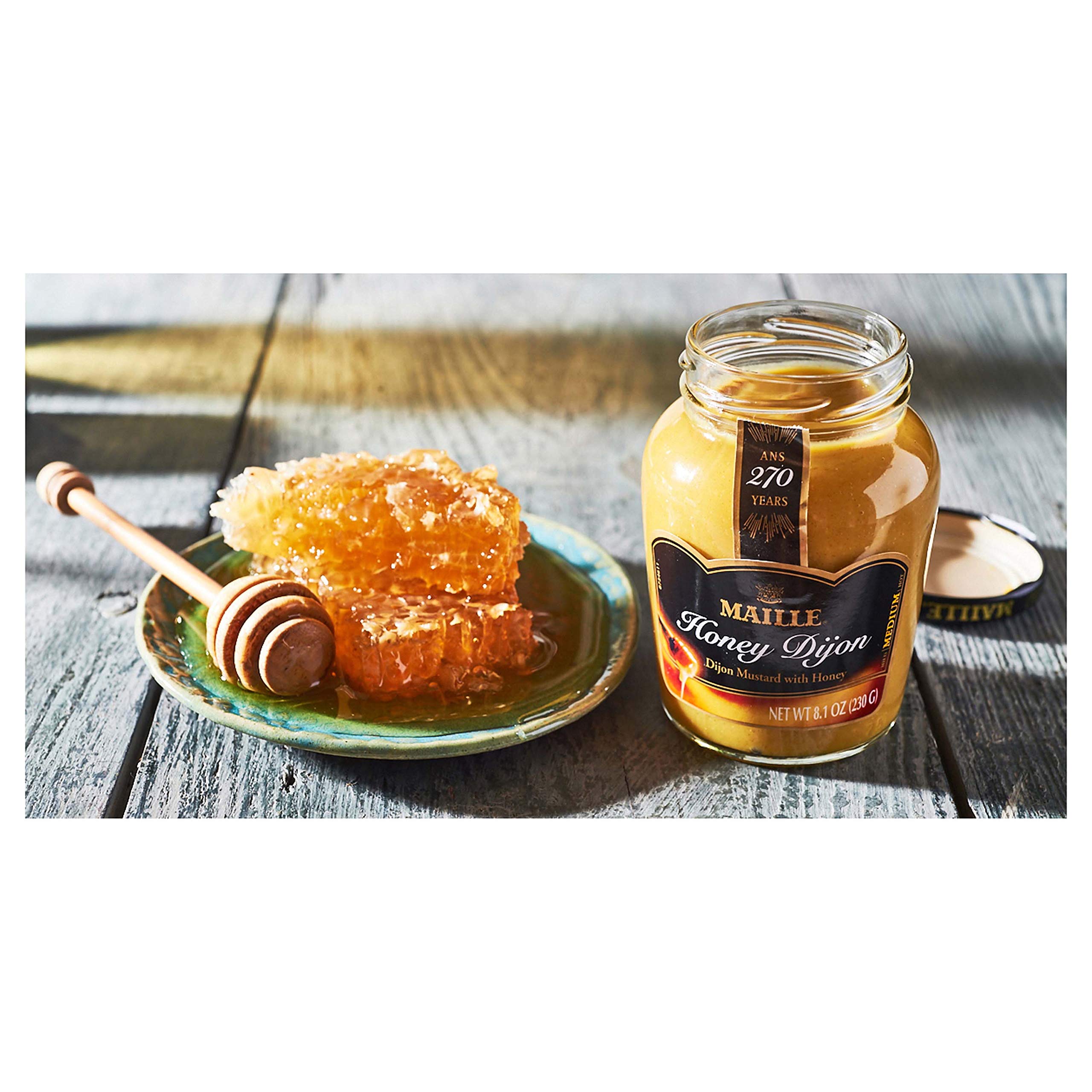Maille-glazed roasted vegetables with caramelized edges showing enhanced savory-sweet taste
