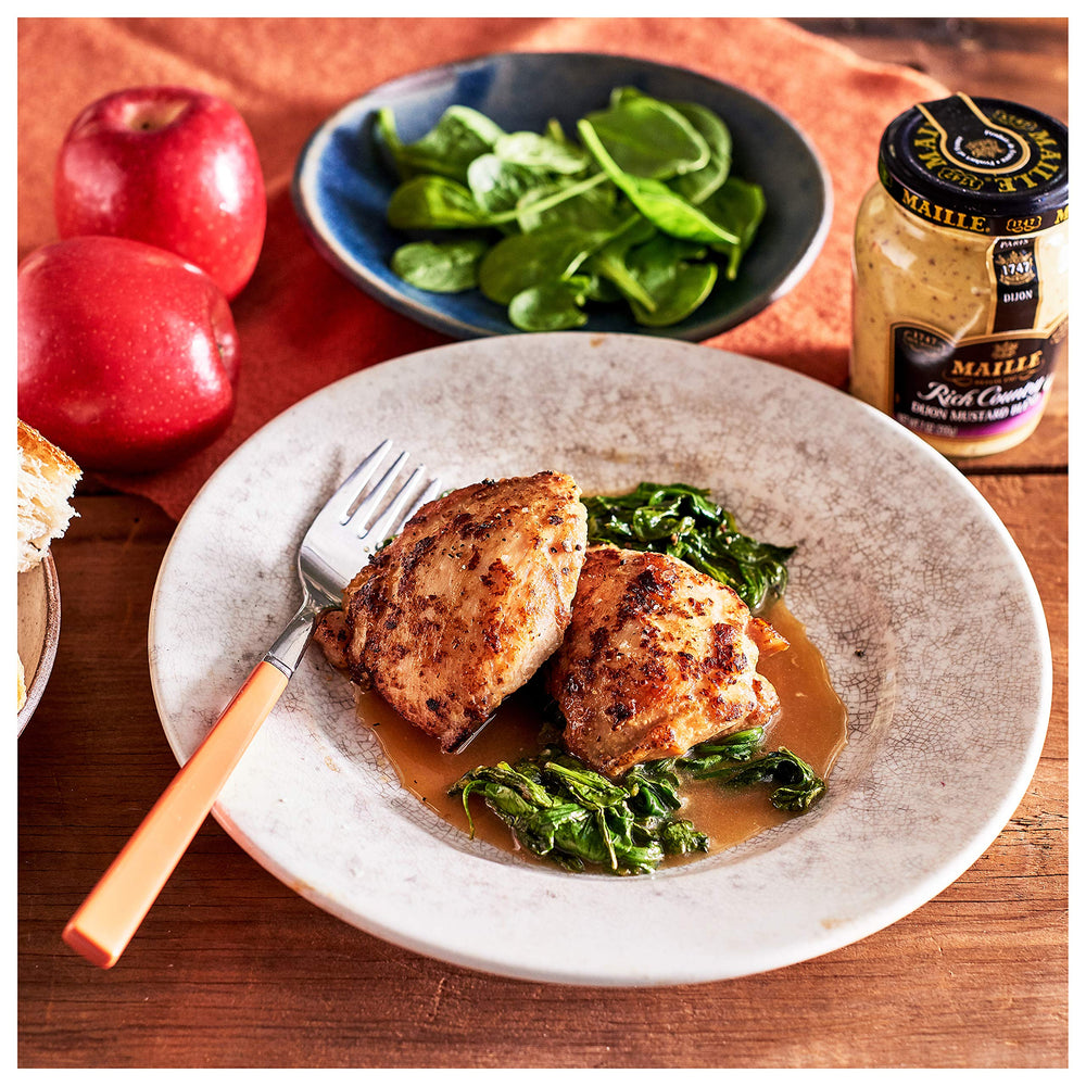 Maille Honey Dijon whisked into vinaigrette in bowl for smooth emulsified dressings benefit