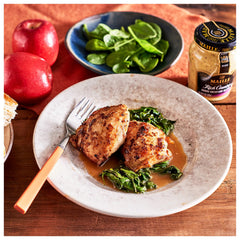 Maille Honey Dijon whisked into vinaigrette in bowl for smooth emulsified dressings benefit