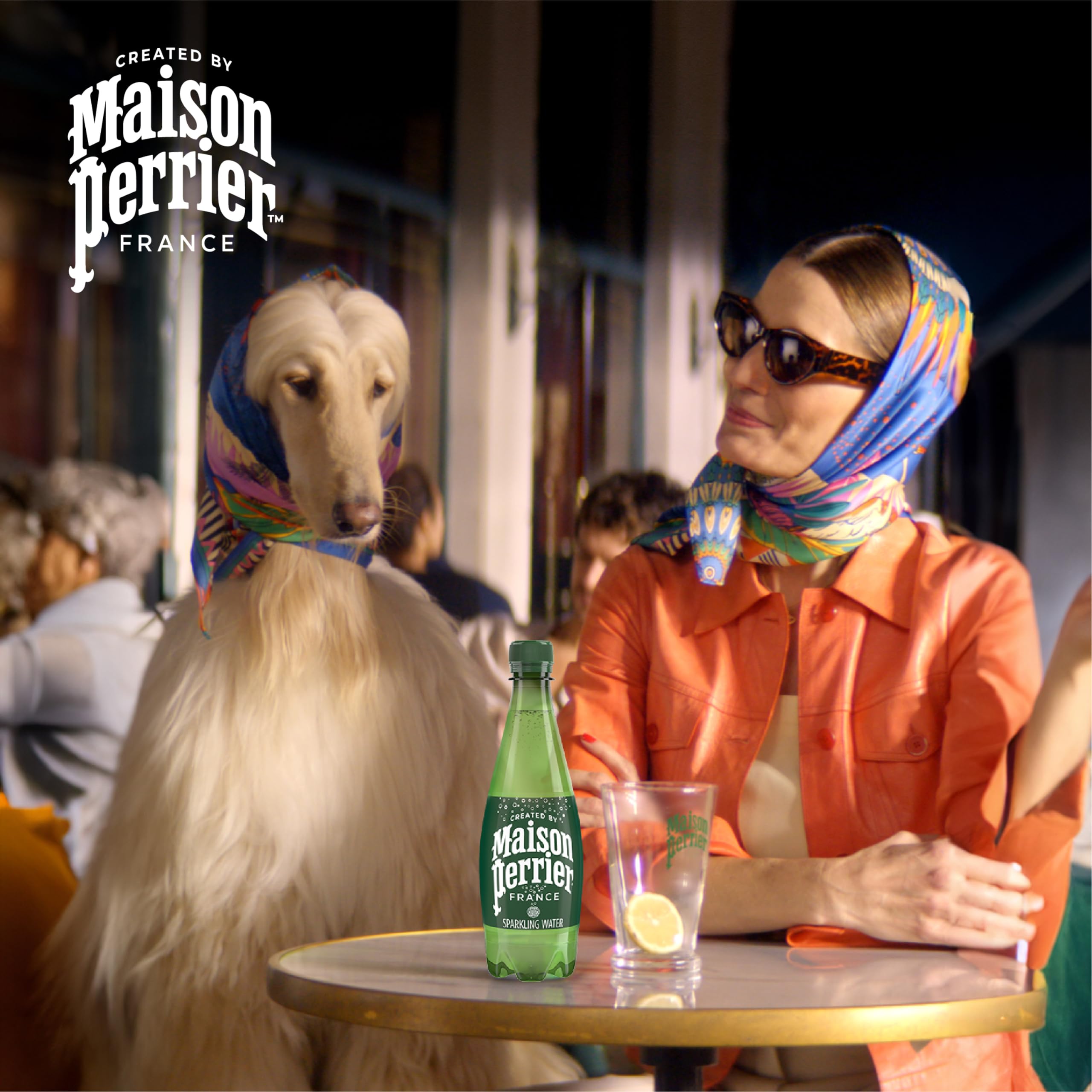 Maison Perrier bottle in hand showing portable 16.9 fl oz size benefit