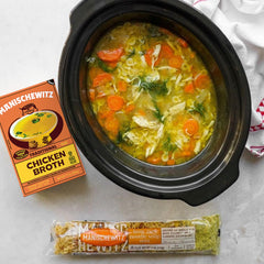 Manischewitz rich golden broth in bowl showing texture and deep savory color for recipes