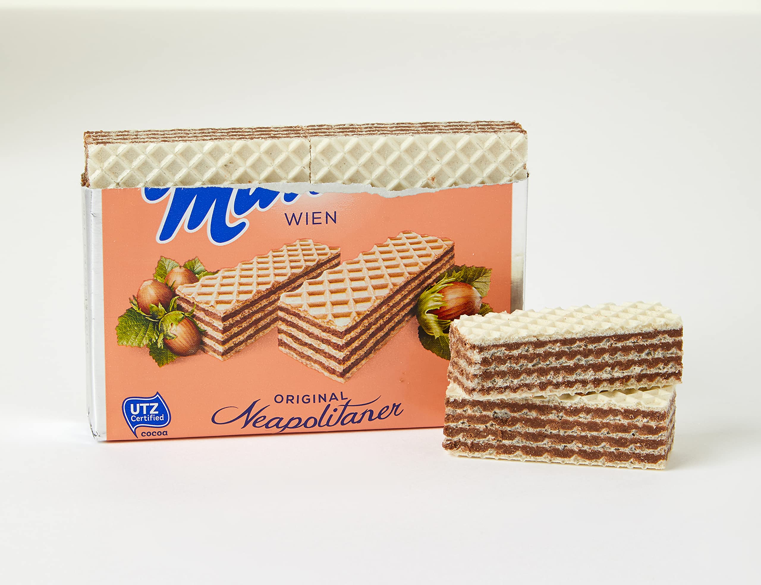 Manner close-up of hazelnut cream layers and crisp wafer texture for flavor clarity