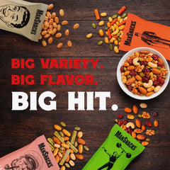 Hand holding a ManSnacks 2 oz pack to show size and grab-and-go convenience
