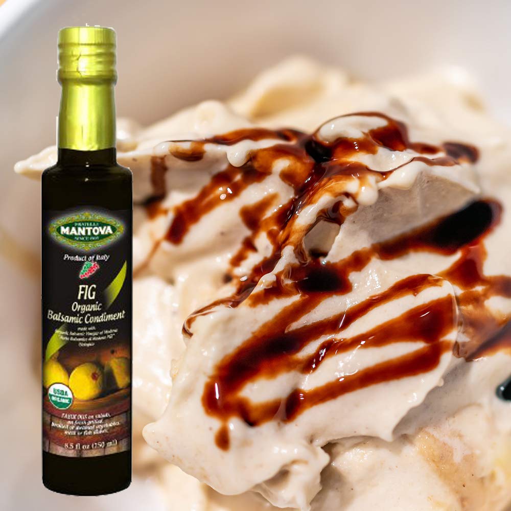 Mantova pear bottle pouring dressing onto greens for bright flavor