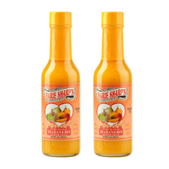 Marie Sharp's front bottle shot showing label and vibrant mango color for shelf appeal
