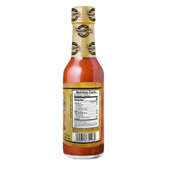 Marie Sharp's sauce drizzled on wings showcasing smoky glaze and flavor boost