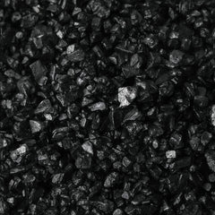 MARKY'S close-up of coarse black crystals highlighting texture and dramatic color contrast