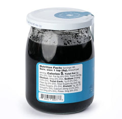 MARKY'S cuttlefish ink close-up texture in spoon, shows glossy consistency for smooth mixing and even color