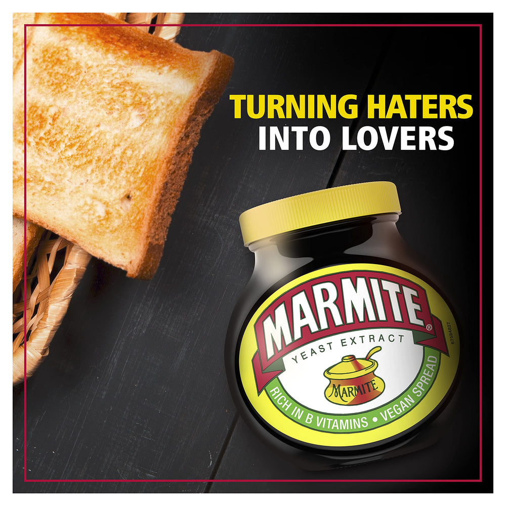 Hand holding Marmite jar to show scale, Marmite jar size comparison