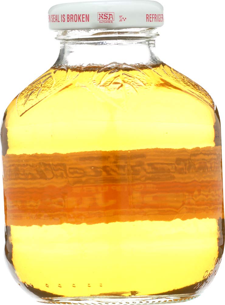 Martinelli's poured into glass showing clear golden color and refreshing taste