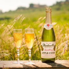 Martinelli's pouring into flute glass capturing bubbles and festive refreshment benefit