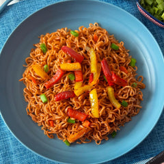 Maruchan Fire Yakisoba prepared bowl in hand showing ready-to-eat convenience and heat