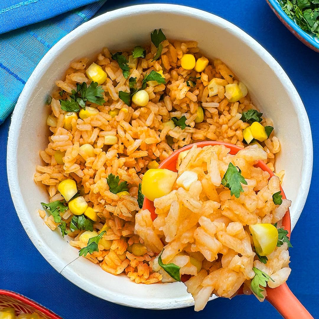 Maruchan rice bowl topped with vegetables and chicken, customizable hearty meal