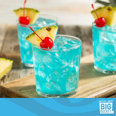 MASTER OF MIXES pouring Blue Hawaiian mix over ice for fast cocktail service