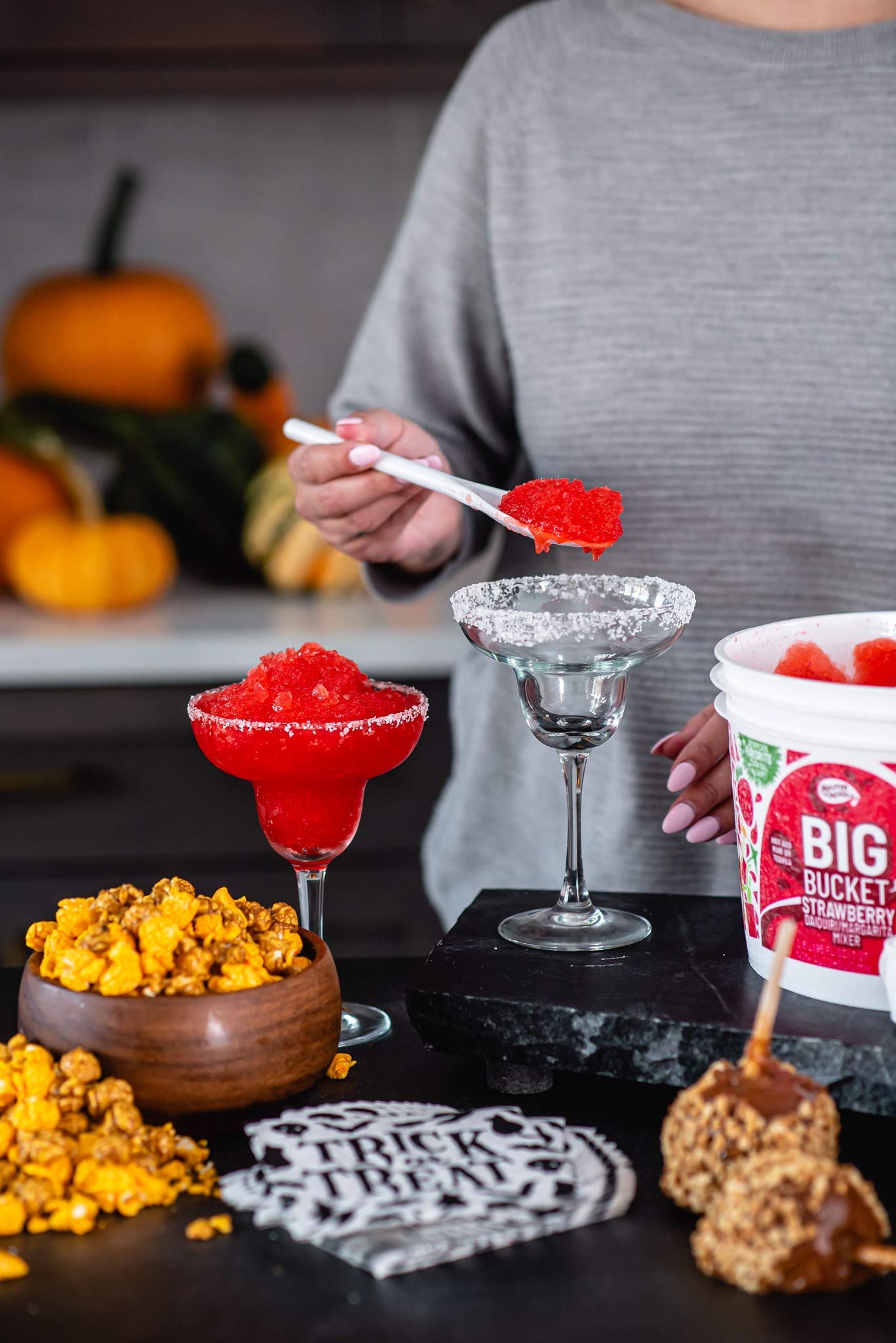 MASTER OF MIXES frozen strawberry margarita in glass demonstrating bright color and appealing texture