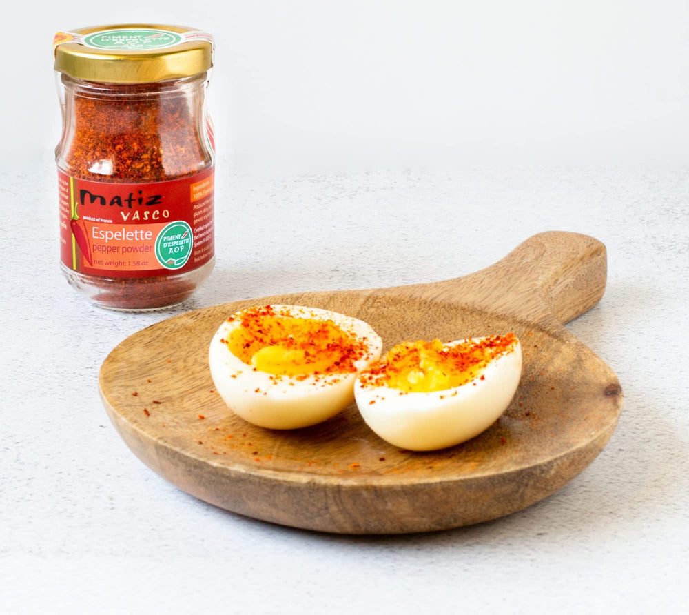 Matiz jar next to teaspoon for scale, showing convenient 1.58 oz portion