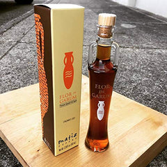 Matiz Espana pouring garum into spoon showing concentrated savory intensity