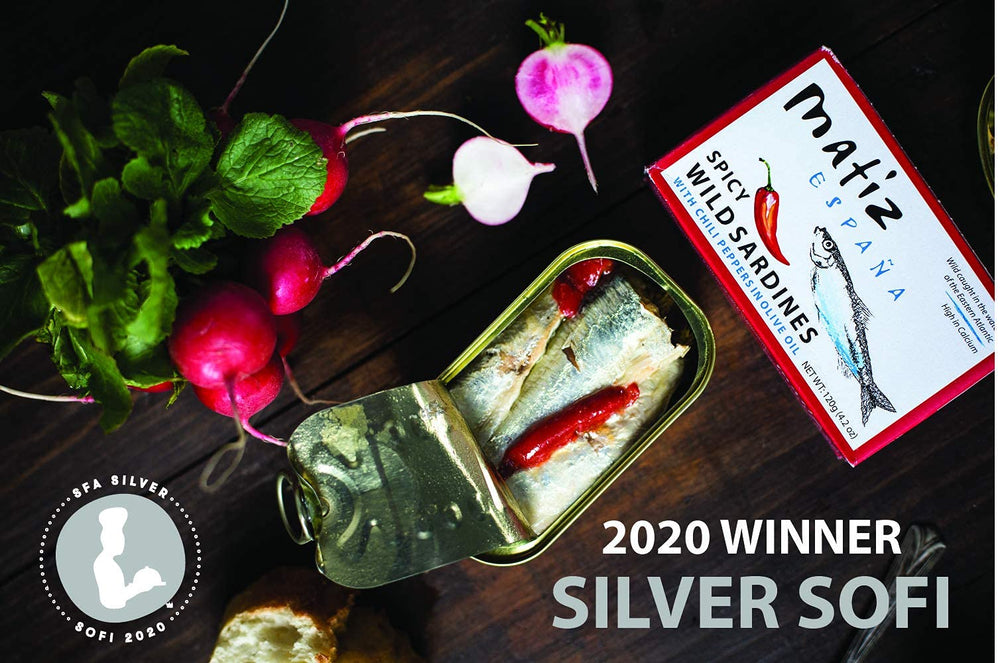 Matiz olive oil drizzle over sardines emphasizing preserved moistness and taste