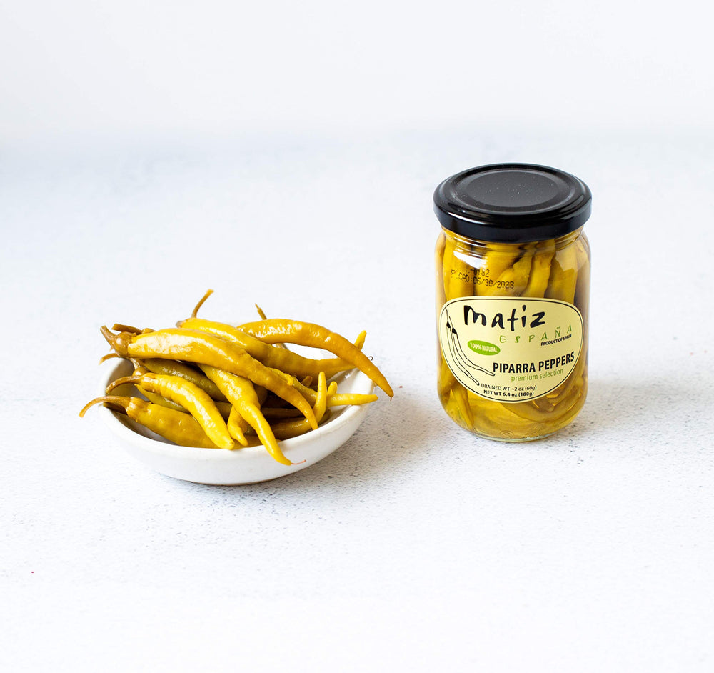 Matiz piparras in jar top view showing brine and natural freshness
