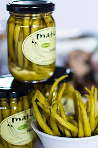 Matiz piparras beside smoked fish offering bright contrast and flavor