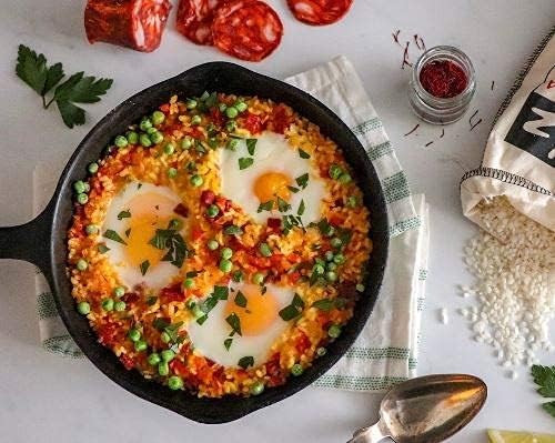Matiz Valenciano paella served on table indicating finished dish appeal and family sharing