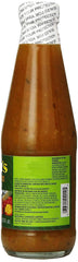 Matouk's bottle held in hand to show size and pourability, useful for portioning