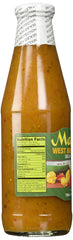 Matouk's bottle next to a drinking glass to show 26 oz scale benefit: easy portioning