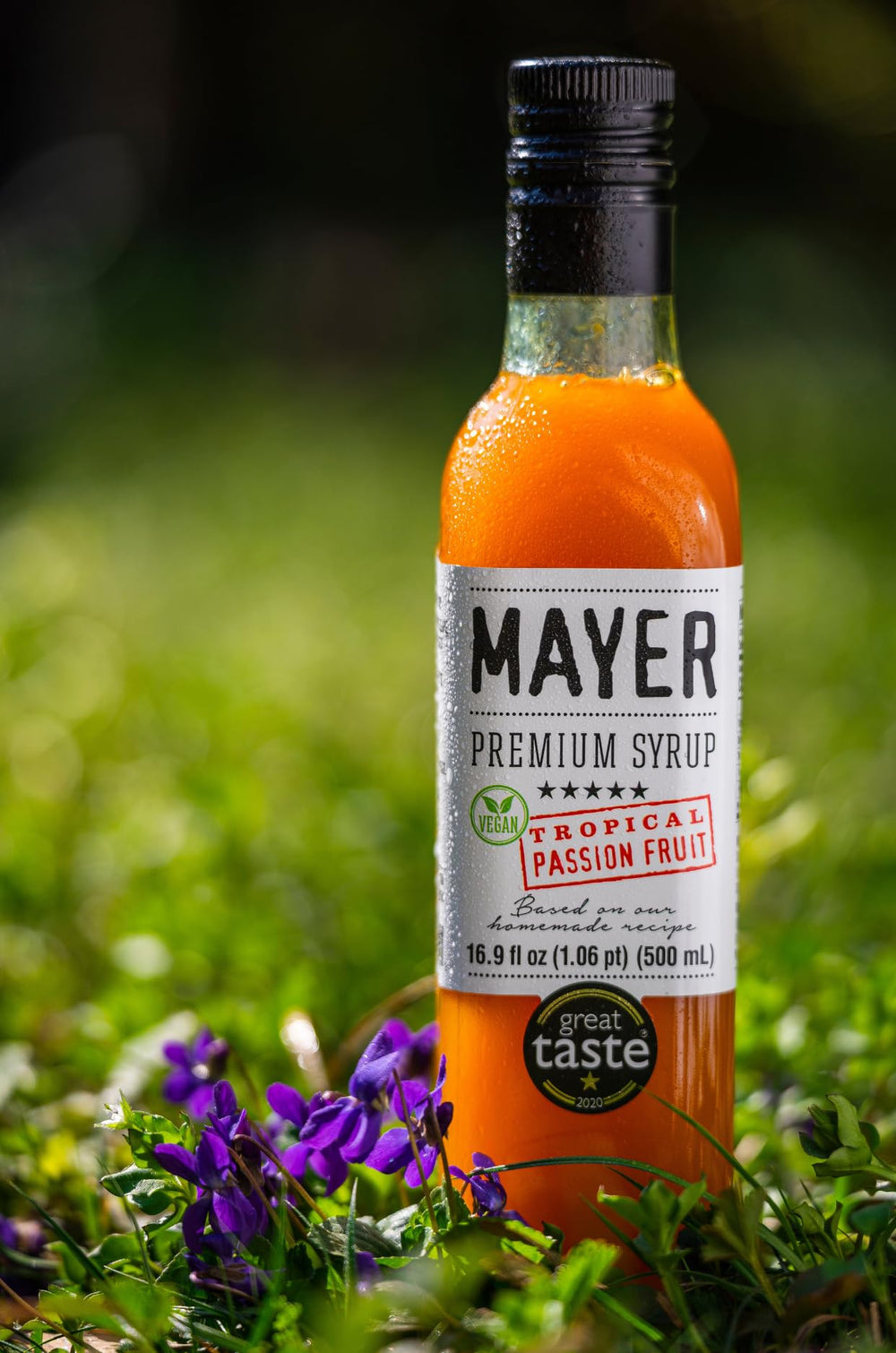 Mayer bottle beside glass for scale showing compact professional-size bottle