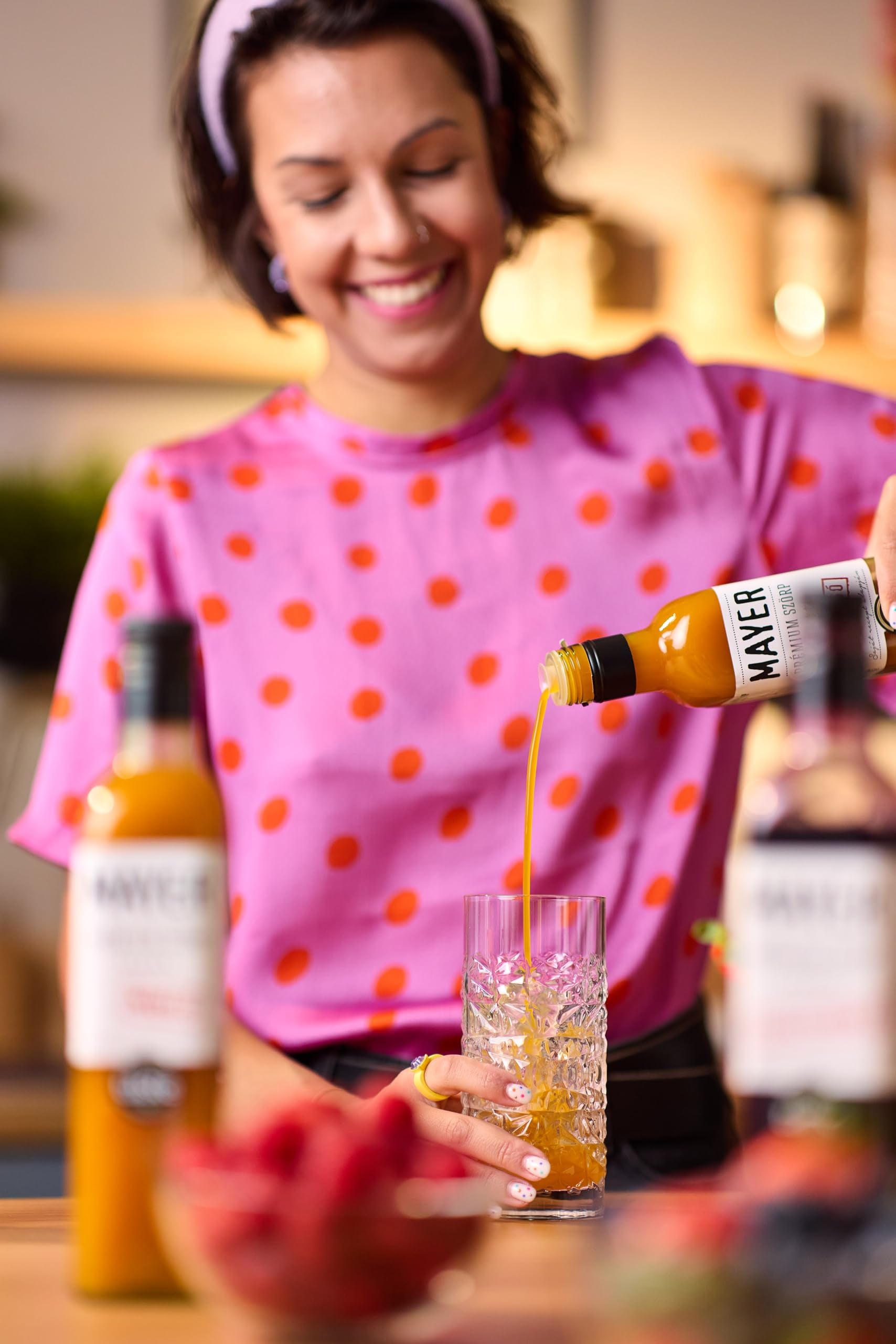 Fresh passion fruits with Mayer bottle showing real-fruit ingredient emphasis
