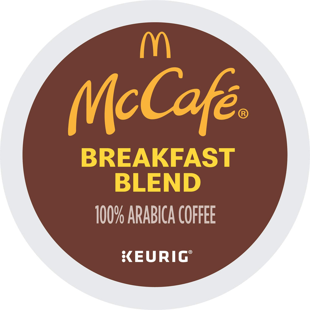 McCafé box next to hand for size comparison and storage convenience