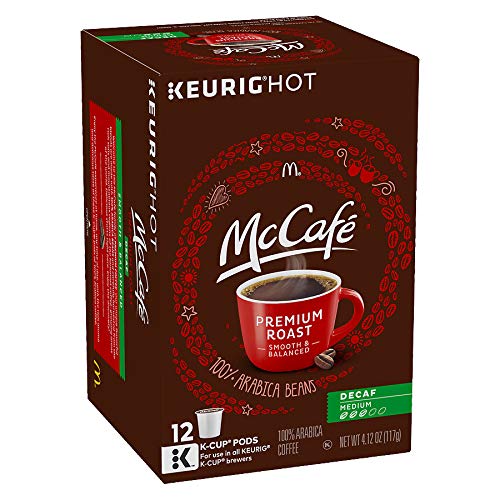 McCafé pods beside a coffee cup for scale demonstrating portion control and storage ease