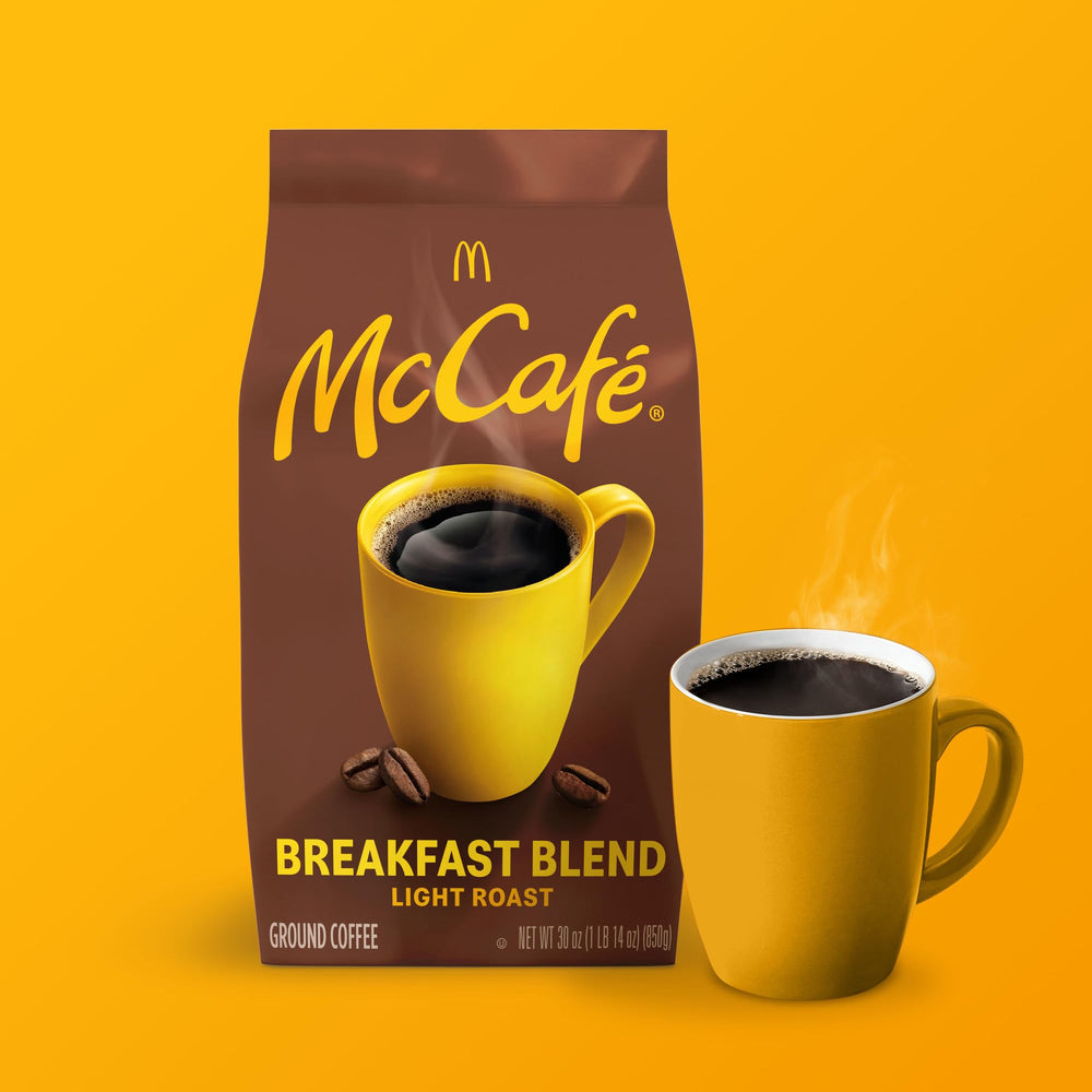 McCafé morning kitchen scene with cup and bag conveying approachable daily ritual