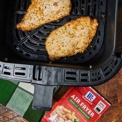 McCormick seasoned chicken plated from air fryer highlighting flavorful, lower-oil crisp
