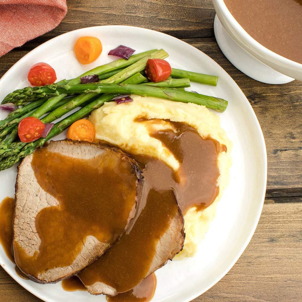 McCormick gravy pouring over mashed potatoes adding savory flavor